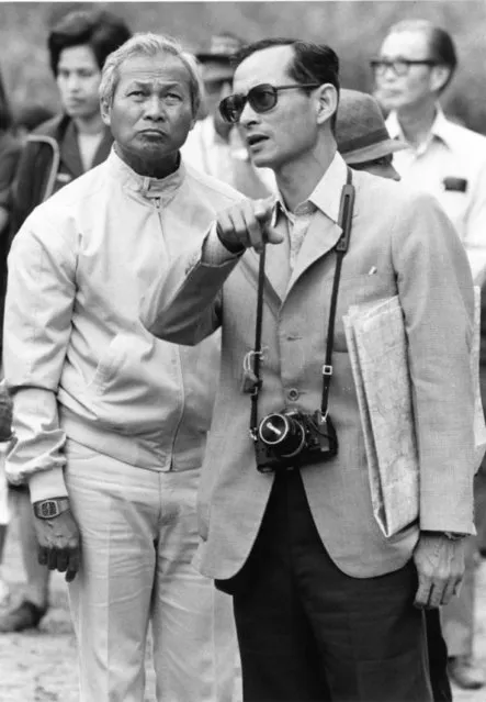 King Bhumibol talks with Thailand Prime Minister Gen. Prem Tinsulanonda as they visit an irrigation project in Northern Thailand recently, February 16, 1981. Gen. Prem helped the King play host to visiting foreign ambassadors from Bangkok. (Photo by AP Photo)