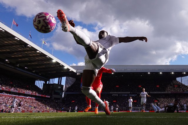 Calvin Bassey of Fulham attempts to clear the shot from Ollie Watkins of Aston Villa who scores his team's first goal during the Premier League match between Aston Villa and Fulham at Villa Park on September 28, 2025 in Birmingham, England. (Photo by Justin Setterfield/Getty Images)