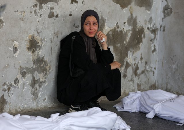A mourner attends the funeral of Palestinians killed in Israeli strikes, according to medics, at Al-Ahli Arab Hospital in Gaza City on August 12, 2025. (Photo by Dawoud Abu Alkas/Reuters)