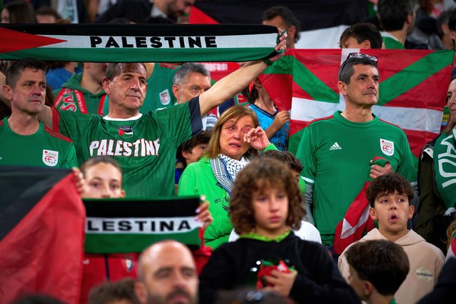 Fans wave Palestinian flags and flags of the northern Basque Country region during a friendly match between a selection of Palestinian players and a group of Spanish players from the Basque Country, held to protest Israel's military actions in Gaza, in Bilbao, Spain, Saturday, November 15, 2025. (Photo by Miguel Oses/AP Photo)