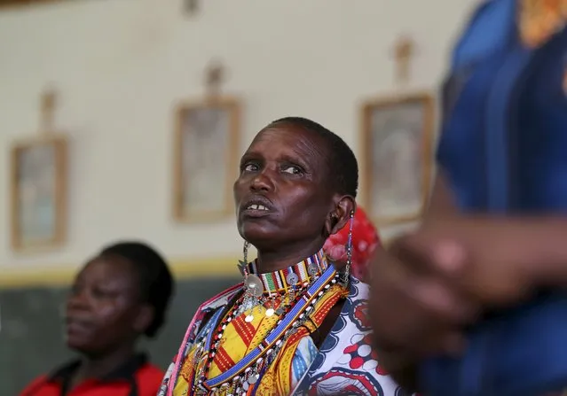 Maasai women attend a Sunday Mass in a Catholic church in town of Ewuaso, Kenya, November 8, 2015. Pope Francis' first Africa trip will highlight the problems of building dialog between Christianity and Islam as both religions grow fast on the continent, threatening to widen an already volatile fault line there between them. (Photo by Goran Tomasevic/Reuters)