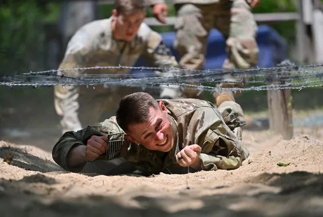 US soldiers take part in an obstacle course during the Best Squad Competition, conducted by the US 2nd Infantry Division and the ROK-US Combined Division at the US Army's Camp Casey in Dongducheon on May 3, 2023. (Photo by Jung Yeon-je/AFP Photo)