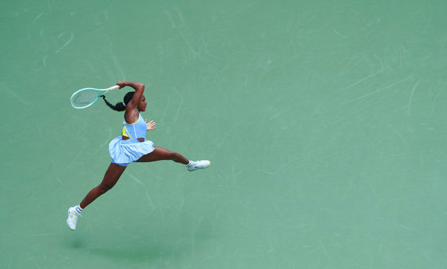 A leaping Coco Gauff fires off a return at US Open Championships 2024, Day One, in New York on August 26, 2024. (Photo by Javier Garcia/Rex Features/Shutterstock)
