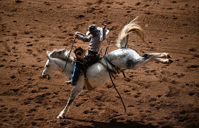 Clayton Braden competes in the open saddle bronc during Mount Isa Mines Rodeo event at the on August 10, 2024 in Mount Isa, Australia. The 2024 Mount Isa Mines Rodeo, Australia's largest rodeo and the biggest in the Southern Hemisphere, is set to take place from August 8-11 at the Buchanan Park Events Complex in Mount Isa, Queensland. This iconic event, running since 1959, will feature four days of non-stop rodeo action, attracting around 750 competitors from across Australia to compete for the richest prize pool in the country. The rodeo will showcase various events in its famous open-air, red dirt arena. In addition to the thrilling rodeo competitions, attendees can enjoy live entertainment, Rodeo Rock Concerts, outback market traders, and food stalls throughout the festival. (Photo by Dan Peled/Getty Images)