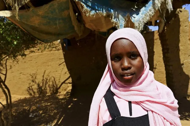 Manasik Yousif Abdo-Rahman, a 4th grader at the Alsalam camps for the internally displaced persons poses for a photograph in El-Fasher in North Darfur, Sudan, November 17, 2015. Born in the camp, 12-year-old Abdo-Rahman wishes to be an electric engineer in her adulthood. (Photo by Mohamed Nureldin Abdallah/Reuters)