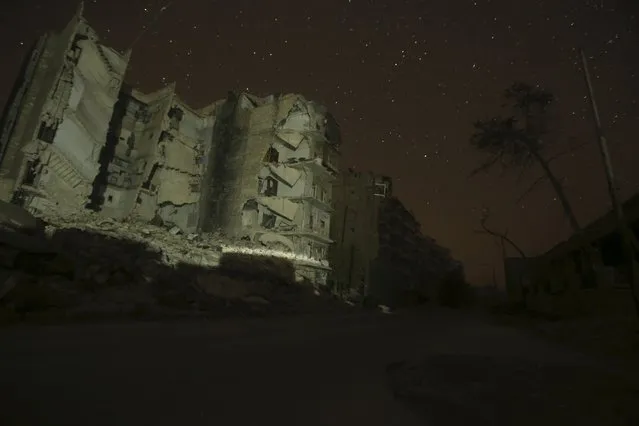 Damaged buildings are pictured at night in Aleppo, Syria December 11, 2015. (Photo by Ammar Abdullah/Reuters)
