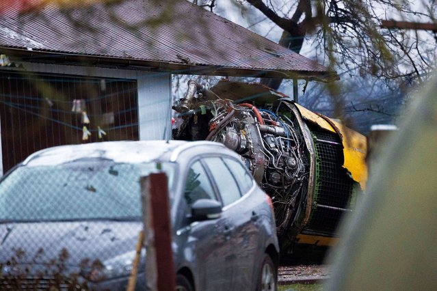 The wreckage of the DHL cargo plane is seen at the crash site near Vilnius International Airport, Lithuania on November 25, 2024. (Photo by Lukas Balandis/BNS via Reuters)