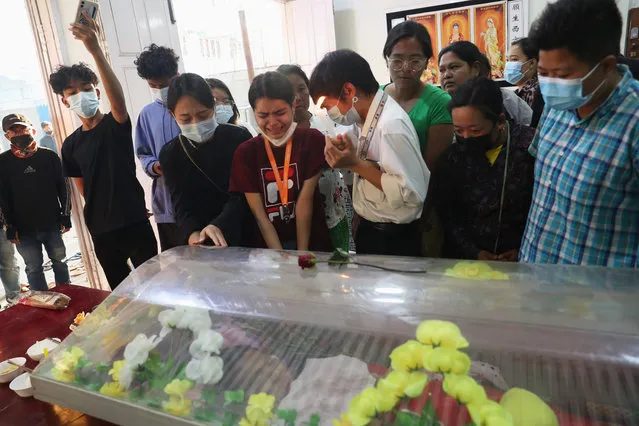 People mourn as they view the body of Kyal Sin, also known by her Chinese name Deng Jia Xi, a 20-year-old university student who was shot in the head while she attended an anti-coup protest rally in Mandalay, Myanmar Wednesday, Mar. 3, 2021. Myanmar security forces shot and killed multiple people Wednesday, according to accounts on social media and local news reports, as authorities extended their lethal crackdown on protests against last month's coup. (Photo by AP Photo/Stringer)