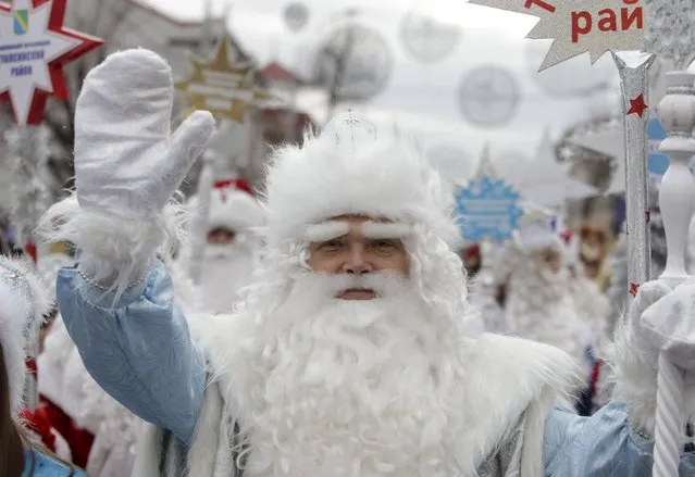 A man, dressed as Ded Moroz, takes part in a festive pre-holiday procession in Krasnodar, southern Russia, December 19, 2015. (Photo by Eduard Korniyenko/Reuters)