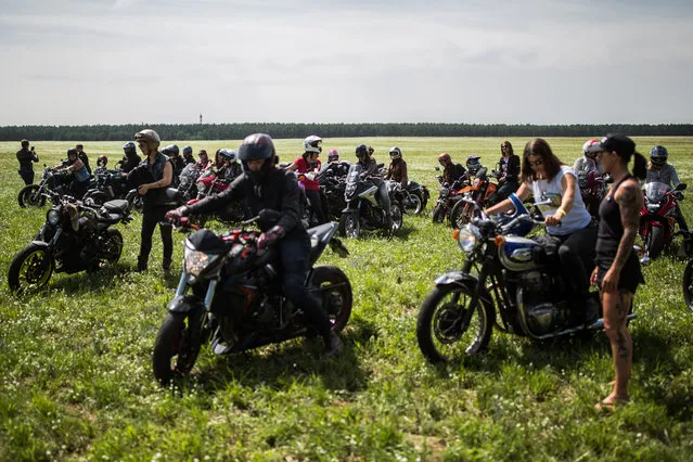 Participants ride a motorbikes at the women's-only Petrolettes motorcycle festival on July 21, 2018 in Milmersdorf, near Berlin in Germany. (Photo by Maja Hitij/Getty Images)