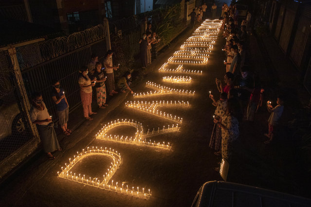 Protesters are holding the candles to pray for the victims of military in Yangon on March 7, 2021. Thousands of people took the streets of Yangon on the 35th day of the protest against a military coup and demanded the release of Aung San Suu Kyi. Myanmar's Military detained State Counsellor of Myanmar Sung San Suu Kyi on 1st of February, 2021 and declared a state of emergency while seizing the power in the country for a year after losing the election against the National League for Democracy. (Photo by Thuya Zaw/ZUMA Wire/Rex Features/Shutterstock)