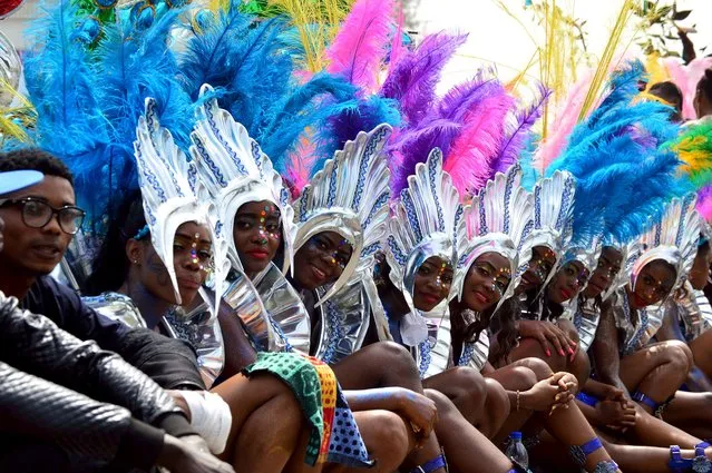 Performers smile during the annual Calabar cultural festival in Calabar, Nigeria, December 28, 2015. (Photo by Reuters/Stringer)