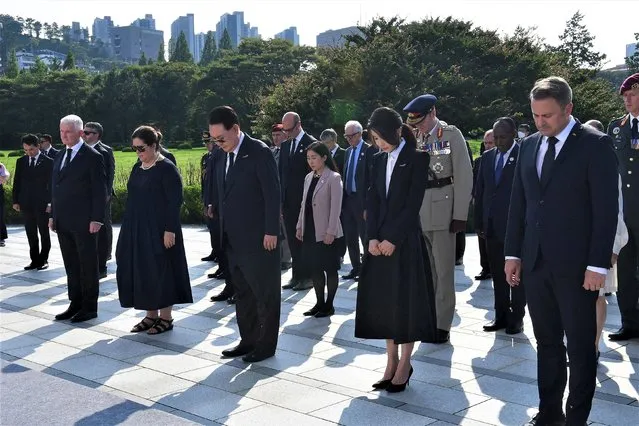 South Korea's President Yoon Suk Yeol (3rd L) and his wife Kim Keon-hee (2nd R) attend a ceremony for the Korean War UN veterans day at the UN Memorial Cemetery in Busan on July 27, 2023. (Photo by Kim Min-Hee/Pool via AFP Photo)