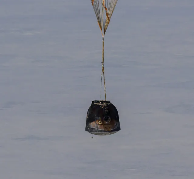 The Soyuz MS-17 spacecraft is seen as it lands in a remote area near the town of Zhezkazgan, Kazakhstan with Expedition 64 crew members Kate Rubins of NASA, Sergey Ryzhikov and Sergey Kud-Sverchkov of Roscosmos, Saturday, April 17, 2021. Rubins, Ryzhikov and Kud-Sverchkov returned after 185 days in space having served as Expedition 63-64 crew members onboard the International Space Station. (Photo by Bill Ingalls/NASA via AP Photo)