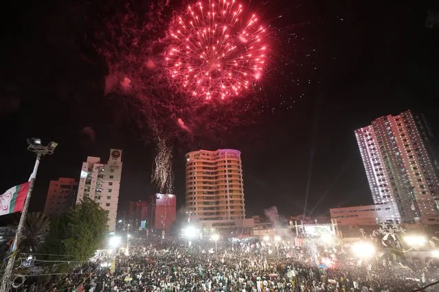 People gather to watch fireworks during the Pakistan Independence Day celebrations, in Karachi, Pakistan, Monday, August 14, 2023. (Photo by Fareed Khan/AP Photo)