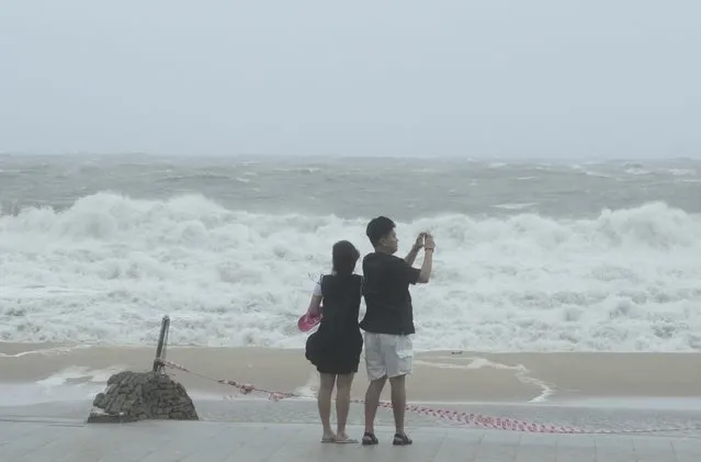 High waves crash a shore as the tropical storm named Khanun approaches to the Korean Peninsular, in Busan, Thursday, August 10, 2023. (Photo by Ahn Young-joon/AP Photo)