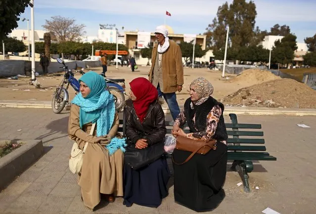 Women sit on the bench as they wait for public transport in Kasserine, where young people have been demonstrating for jobs since last week, January 30, 2016. (Photo by Zohra Bensemra/Reuters)