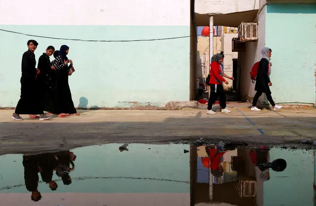 Women leave the gym after their exercise in Diwaniya, Iraq on November 10, 2018. (Photo by Alaa Al-Marjani/Reuters)