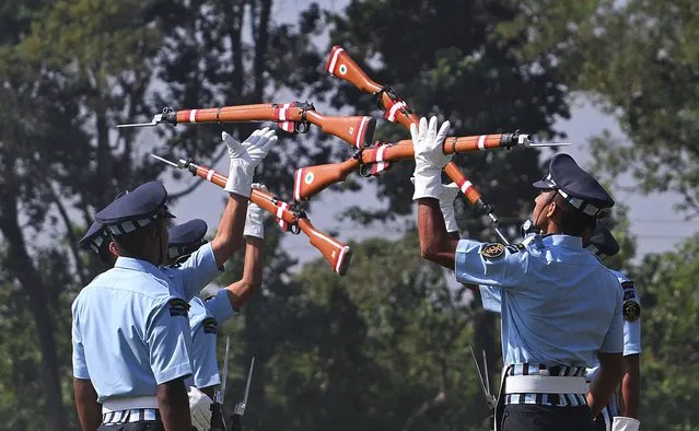 Indian Air force personnel perform a drill during raising day celebrations of the Goalpara Sainik School or military school in Goalpara, Assam state, India, Tuesday, Nov. 12, 2013. The Sainik Schools are a system of schools established with the objective of preparing students to lead as officers in the Defense Services of the country. (Photo by Anupam Nath/AP Photo)