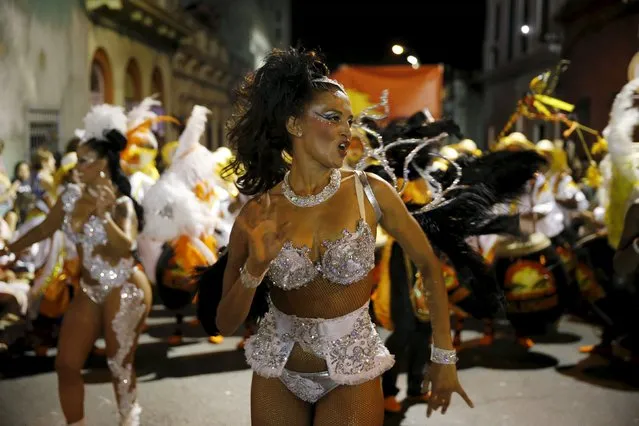 Members of a comparsa, a Uruguayan carnival group, dance during the Llamadas parade in Montevideo February 5, 2016. (Photo by Andres Stapff/Reuters)