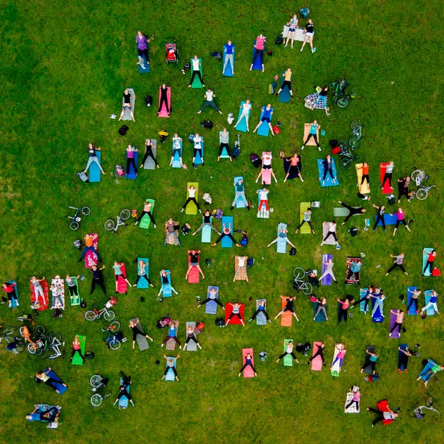 Karolis Janulis, Lithuania. Open Competition; People. People take part in a mass yoga exercise in the central park of Vilnius, Lithuania’s capital. (Photo by Karolis Janulis/Sony World Photography Awards)
