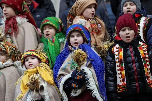 Children dressed in Ukrainian traditional costumes attend a Christmas celebration, amid Russia's attack on Ukraine, in Lviv, Ukraine on December 24, 2023. (Photo by Roman Baluk/Reuters)