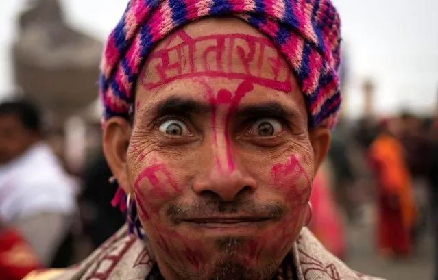 A Hindu devotee reacts as he arrives ahead of the opening of the grand temple of Lord Ram in Ayodhya in India, on January 19, 2024. (Photo by Adnan Abidi/Reuters)