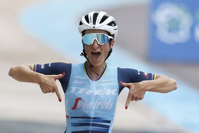 Elisabeth Deignan of Britain celebrates as she crosses the finish line to win the women's Paris Roubaix, a 116 kilometer (72 miles) one-day-race, at the velodrome in Roubaix, northern France, Saturday, October 2, 2021. (Photo by Michel Spingler/AP Photo)