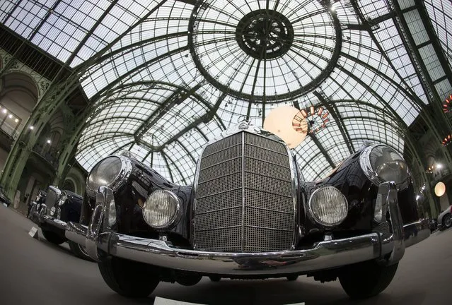A 1954 Mercedes-Benz 300 S Cabriolet A is displayed during a press preview before a mass auction of vintage vehicles organised by Bonhams auction house as part of “Retromobile Week” at the Grand Palais in Paris, France, 05 February 2014. (Photo by Ian Langsdon/EPA)