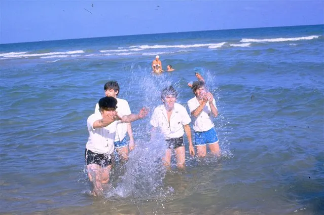 The Beatles, from left, John Lennon, Paul McCartney, George Harrison and Ringo Starr, splash in the water in Nassau, Bahamas, during filming of “Help!”  in February 1965. (Photo by AP Photo)