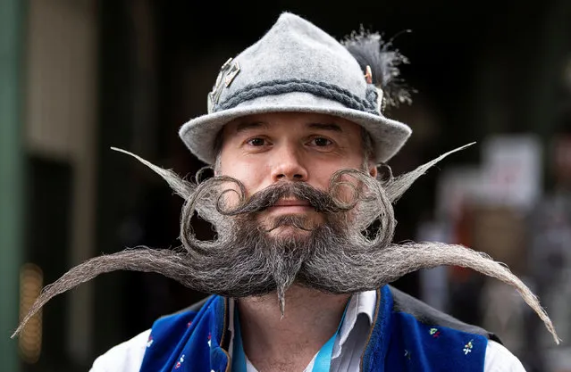 Participant Christian Feicht from Germany poses during the German Moustache and Beard Championships 2021 at Pullman City Western Theme Park in Eging am See, Germany, October 23, 2021. (Photo by Lukas Barth/Reuters)