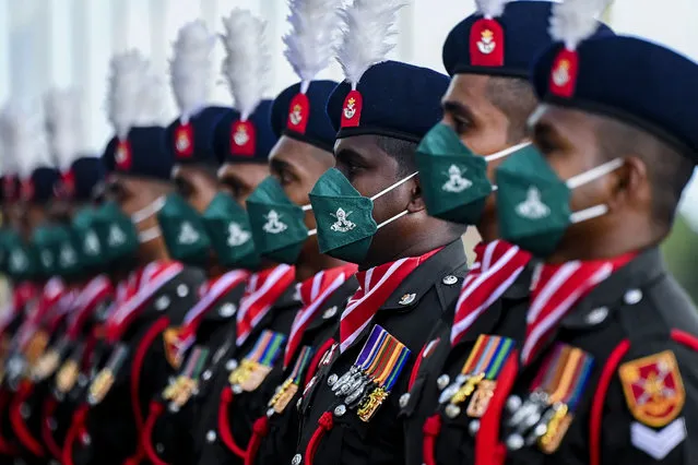 Sri Lanka army personnel stand in formation for the guard of honor during India's Chief of Army Staff General Manoj Mukund Naravane arrives for Sri Lanka Army Headquarters in Colombo on October 13, 2021. (Photo by Ishara S. Kodikara/AFP Photo)