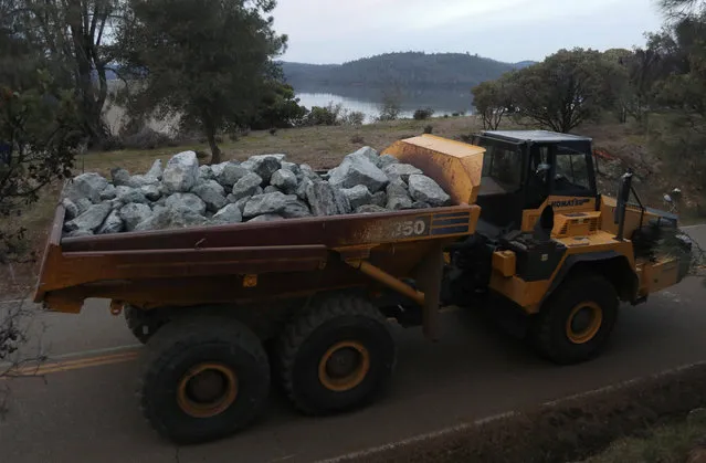 Rock is hauled to the Lake Oroville Dam after an evacuation was ordered for communities downstream from the dam in Oroville, California, U.S. February 13, 2017. (Photo by Jim Urquhart/Reuters)