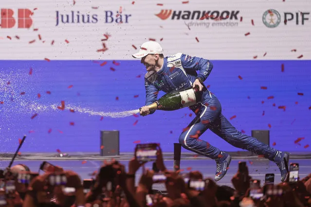 Maximilian Guenther of Germany and MASERATI MSG RACING slips over while celebrating his win on the podium during the Formula E Tokyo E-Prix on March 30, 2024 in Tokyo, Japan. (Photo by Qian Jun/MB Media/Getty Images)
