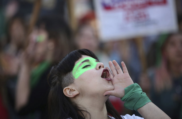 A woman shouts in favor of legalizing abortion, during a demonstration outside the Congress in Buenos Aires, Argentina, Tuesday, May 28, 2019. (Photo by Marcos Brindicci/AP Photo)