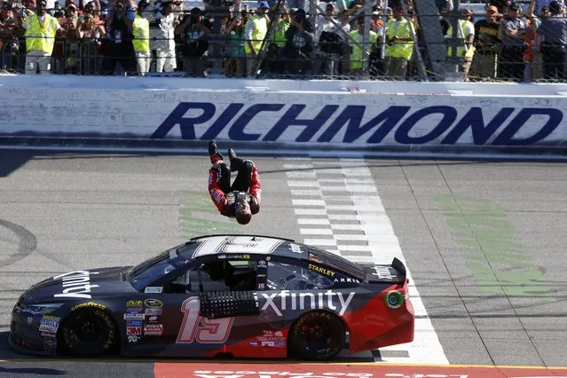 Carl Edwards does a back flip off his car after winning the Sprint Cup auto race at Richmond International Raceway in Richmond, Va., Sunday, April 24, 2016. (Photo by Chet Strange/AP Photo)
