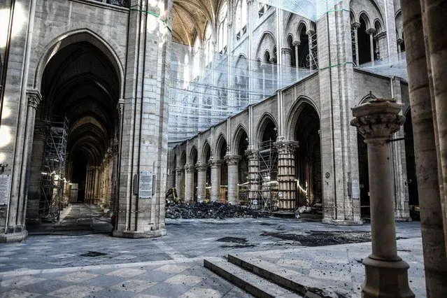 Damage on the nave and rubble during preliminary work in the Notre-Dame de Paris Cathedral three months after a major fire Wednesday, July 17, 2019 in Paris. A French architect says that Notre Dame Cathedral still isn't safe enough for restoration work to begin, more than three months after a devastating fire nearly destroyed the monument. (Photo by Stephane de Sakutin/Pool via AP Photo)