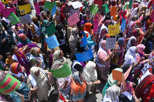 Pakistan's women workers march along a street to mark the International Labour Day, in Lahore on May 1, 2024. (Photo by Arif Ali/AFP Photo)