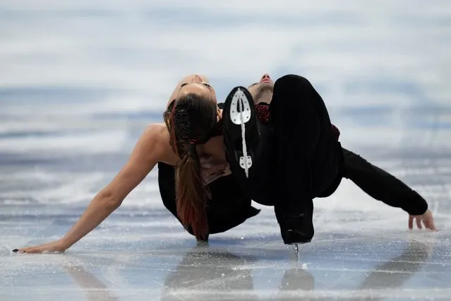 Oleksandra Nazarova and Maksym Nikitin, of Ukraine, perform their routine in the ice dance competition during the figure skating at the 2022 Winter Olympics, Monday, February 14, 2022, in Beijing. (Photo by Bernat Armangue/AP Photo)