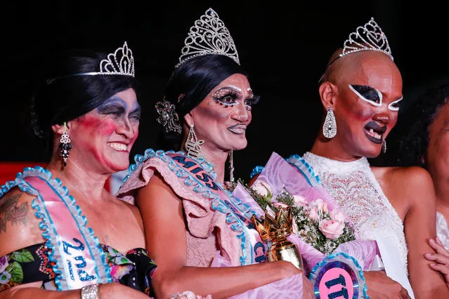 Joel Pedrigal (C) alias “Angel Locsin” poses for pictures with Rolando Picazo (L) alias “Chamcey Supot” and Ariel Bacierra (R) alias “Bea Bunda” after winning the Miss Gay Chararat 2019, a gay beauty contest in Makati, south of Manila, Philippines, early 11 June 2019. Bacierra and Picazo came in second and third, respectively. The pageant is a project of the Committee on Cultural Affairs and Barangay Council in San Antonio, Makati as part of their one week festival honoring Saint Anthony of Padua and in celebration of the LGBT (lesbian, gay, bisexual and transgender) Pride month. Gay beauty pageants have been organized in the Philippines since the late 1970s. Contestants come from different backgrounds and professions with ages ranging from fourteen to more than sixty years old. In recent years, the country saw how gay pageants evolved from being part of local festivities to mainstream social spectacles at the national and even international level. Contestants regard pageants as opportunities to express their creativity, to create awareness against discrimination and to advocate for the recognition of their legal rights. Despite the strides made to break gender stereotypes, the LGBT community in the Philippines still feels that much has to be done to achieve acceptance and equality in a conservative and religiously-biased society. LGBT groups have continuously called for equal rights including legalization of same-s*x marriage and the passage of the Anti-Discrimination Bill. At the end of June, thousands of members and supporters of the LGBT community are expected to join the LGBT Pride March. (Photo by Mark R. Cristino/EPA/EFE)