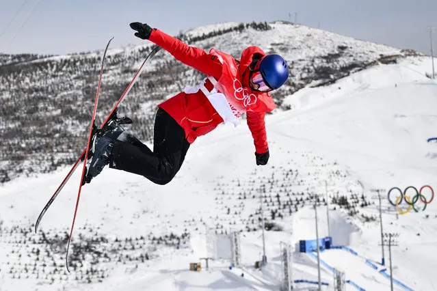 China's Gu Ailing Eileen competes in the freestyle skiing women's freeski halfpipe qualification run during the Beijing 2022 Winter Olympic Games at the Genting Snow Park H & S Stadium in Zhangjiakou on February 17, 2022. (Photo by Marco Bertorello/AFP Photo)