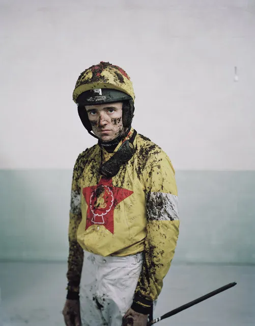 The photo series depicts jockeys post race, covered in mud and looking exhausted, showing the extremes the athletes pursue for their sport. (Photo by Spencer Murphy/Sony World Photography Awards)