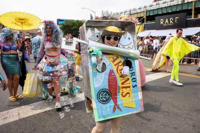 People participate in the Mermaid Parade in Coney Island, Brookly, New York City, U.S., June 22, 2024. (Photo by Caitlin Ochs/Reuters)