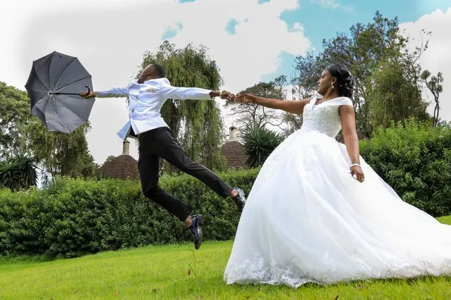 A Kenyan newly-wed couple pose for a photo while at a photo session during their wedding ceremony in Kiambu, Kenya, 14 November 2020. Kenyan President Kenyatta announced on 04 November 2020 the extension of a nationwide COVID-19 night curfew from 10pm to 4am until 03 January 2021 and the ban of political rallies for 60 days as coronavirus infections surged. (Photo by Daniel Irungu/EPA/EFE)