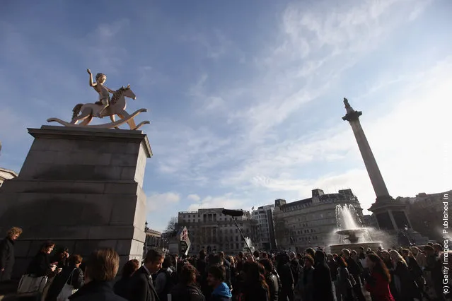 A sculpture entitled 'Powerless Structures, Fig.101' designed by Danish artist Michael Elmgreen and Norwegian artist Ingar Dragset is unveiled on the Fourth Plinth in Trafalgar Square