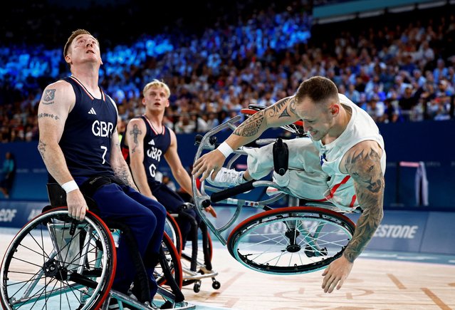 Alexis Ramonet of France falls during France v Britain wheelchair basketball on September 2, 2024. (Photo by Carlos Garcia Rawlins/Reuters)