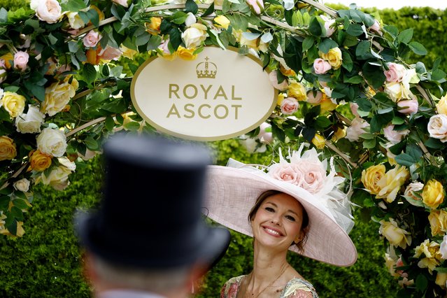 A racegoer attends day one of Royal Ascot 2023 at Ascot Racecourse on June 20, 2023 in Ascot, England. (Photo by John Sibley/Reuters)