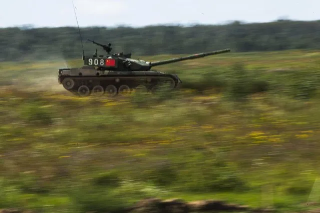 A Chinese tank moves at speed during competition in Alabino, outside Moscow, Russia, Monday, August 3, 2015. (Photo by Pavel Golovkin/AP Photo)