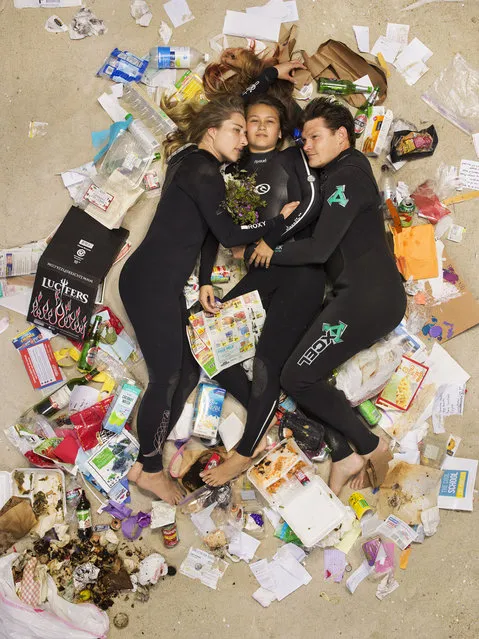 Susan, Curtis and Brittany surrounded by seven days of their own rubbish in Pasadena, California. If you've never thought about how much rubbish you throw away an honest photographic series will open your eyes. Men, women, couples and families with young children have been photographed lying on their backs surrounded by a week's worth of their own rubbish – from old cartons of milk(Photo by Gregg Segal/Barcroft Media)