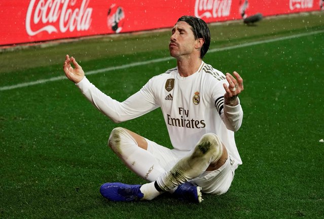 Real Madrid's Spanish defender Sergio Ramos celebrates after scoring a goal during the Spanish league football match between Deportivo Alaves and Real Madrid CF at the Mendizorroza stadium in Vitoria on November 30, 2019. (Photo by Vincent West/Reuters)